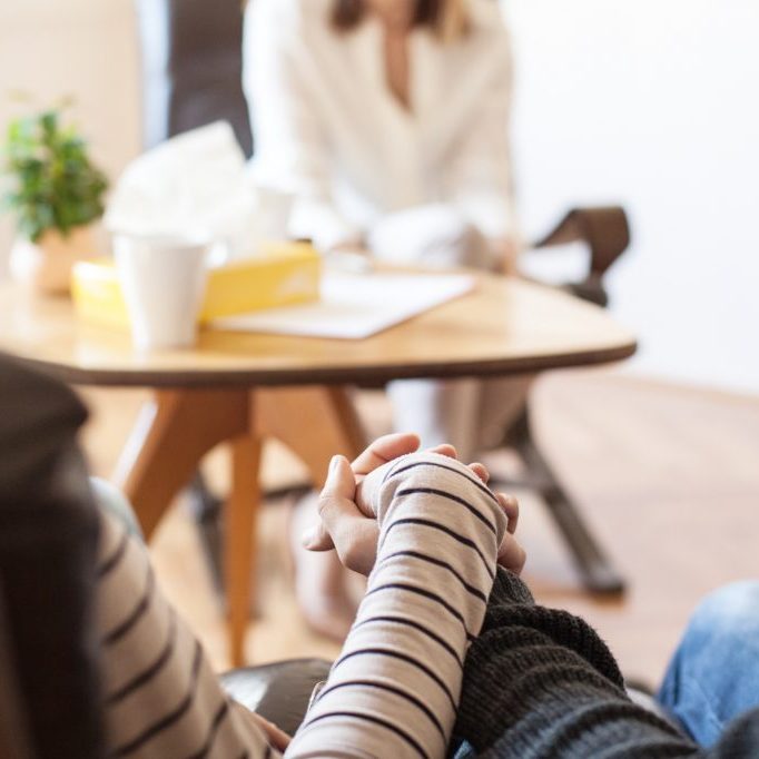 Female Doctor, Gynecologist Talking To her patients, Pregnant Woman and her husband